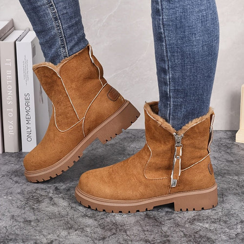 Adaline lug sole ankle boots in light brown suede, worn with jeans, side view