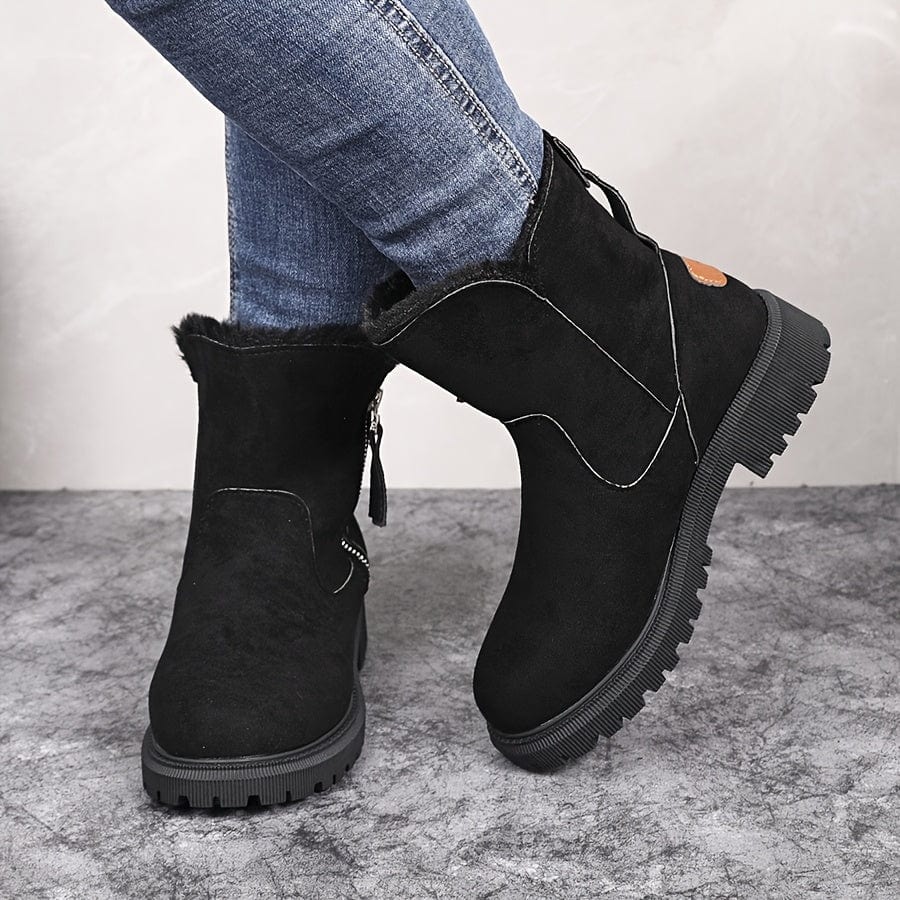 Adaline lug sole ankle boots in black suede, rear three-quarter view showing side zip