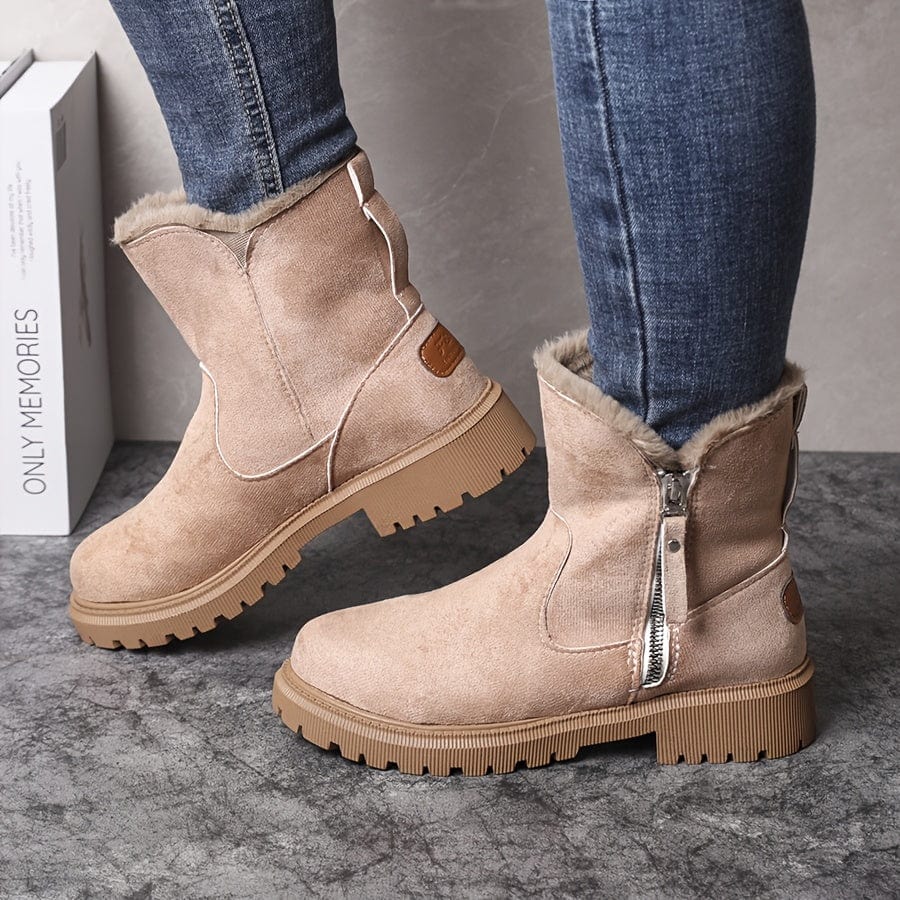 Adaline lug sole ankle boots in beige suede, worn with jeans, side profile view