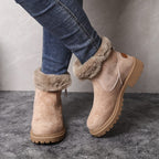 Adaline lug sole ankle boots in beige suede with fur cuff, front three-quarter view
