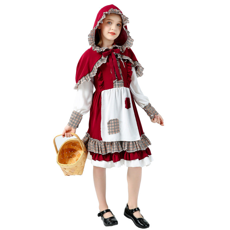 Girl wearing red storybook Halloween costume with hooded capelet, white apron and plaid ruffle hem - view 2