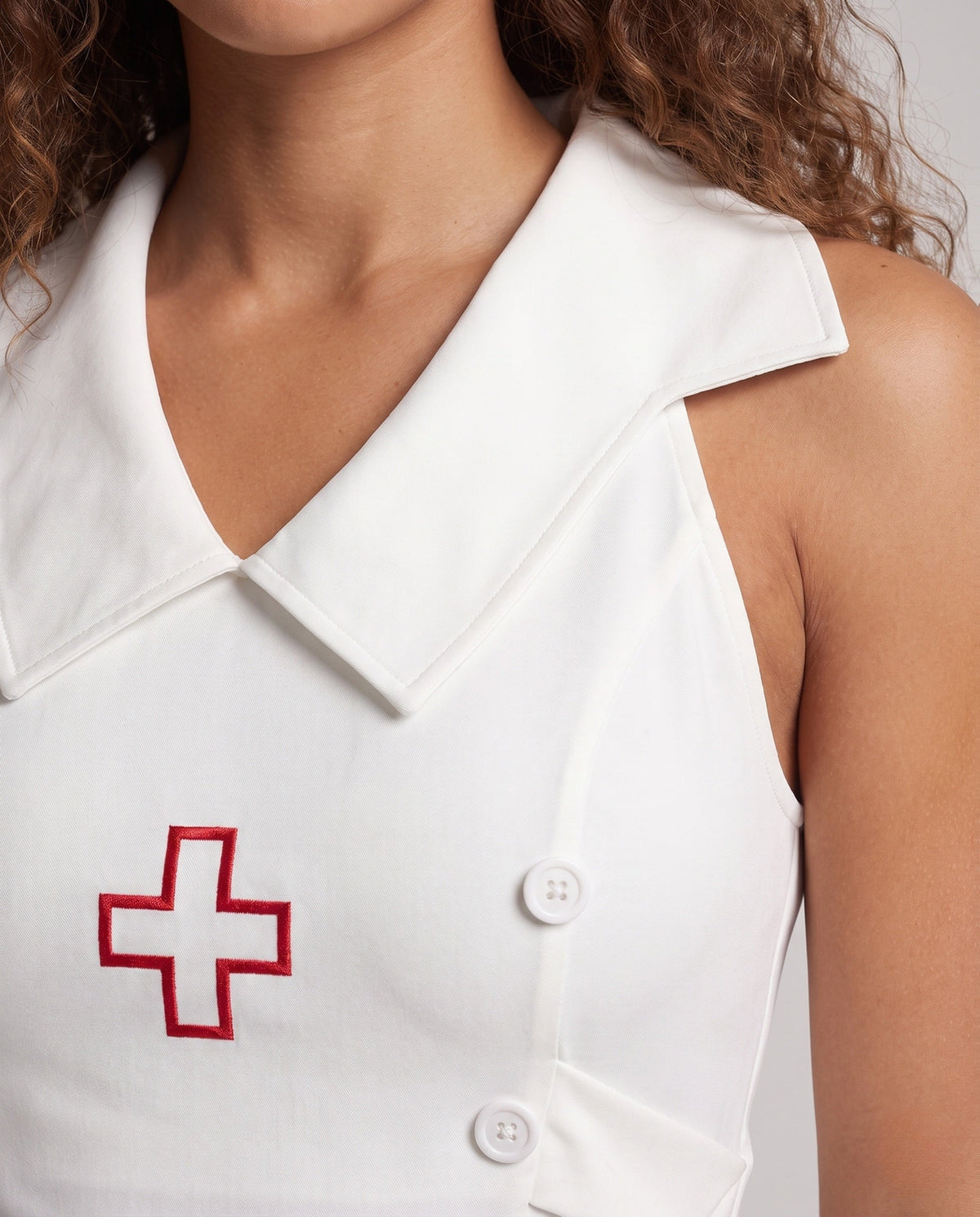 Women's sexy nurse Halloween costume mini dress with wide collar, red cross, hat and patterned stockings - view 3