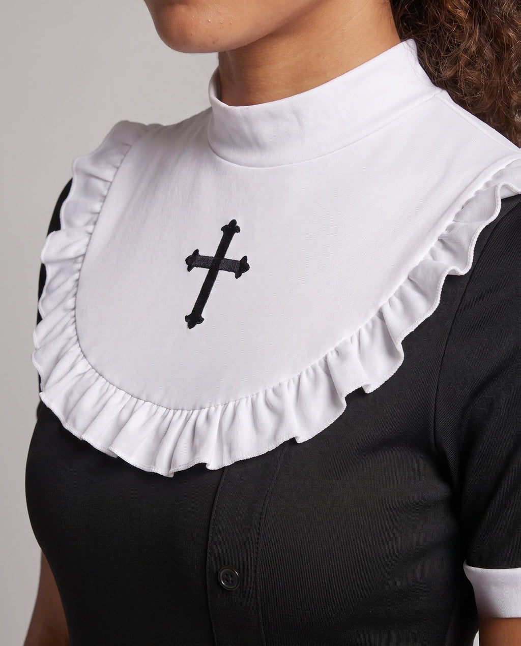 Black nun Halloween costume dress with white ruffled bib, embroidered cross, lace slit and lace veil - view 2