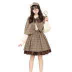 Brown plaid detective Halloween costume with capelet, bow, cream puff-sleeve blouse and ruffle-hem skirt