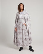 Women's gray tie-dye hooded ghost cape with white ribbon tie over a matching long-sleeve maxi dress