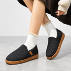 Women's fleece lined slippers with heathered slip-on upper and tan tread sole