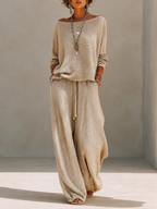 Khaki textured knit pullover and crinkle wide leg pants set on a model