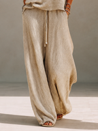 Khaki textured knit pullover and crinkle wide leg pants set on a model - view 7