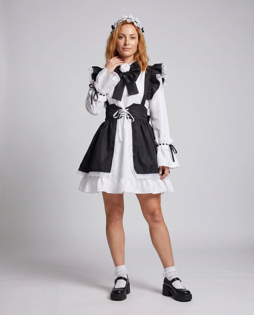 Women's black and white maid Halloween costume with ruffled apron, laced waist and large bow
