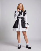 Women's black and white maid Halloween costume with ruffled apron, laced waist and large bow