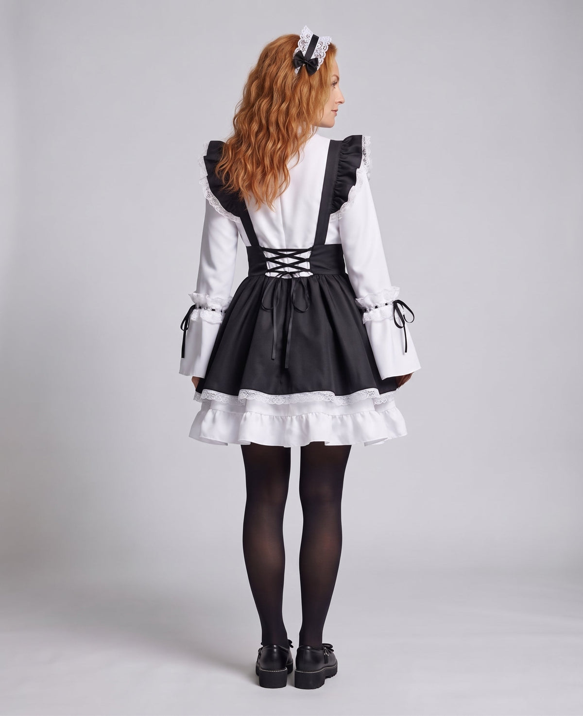 Women's black and white maid Halloween costume with ruffled apron, laced waist and large bow - view 4