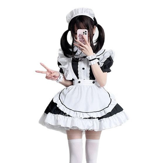 Black and white maid Halloween costume with ruffled white apron, puff sleeves and headpiece