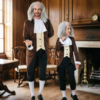 Men's colonial Halloween costume with brown tailcoat, white ruffled jabot, black knee pants and gray wig