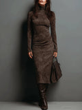 Women's long sleeve faux suede turtleneck midi dress worn with tall boots