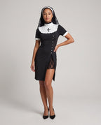 Women's black nun Halloween costume dress with white ruffled bib, cross appliqué and lace-lined slit