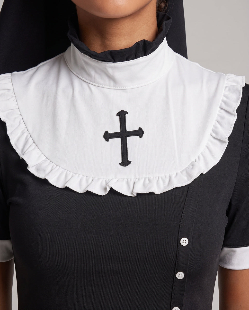 Women's black nun Halloween costume dress with white ruffled bib, cross appliqué and lace-lined slit - view 2