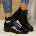 Briar gold chain ankle boots in black leather, close-up of the gold chain trim