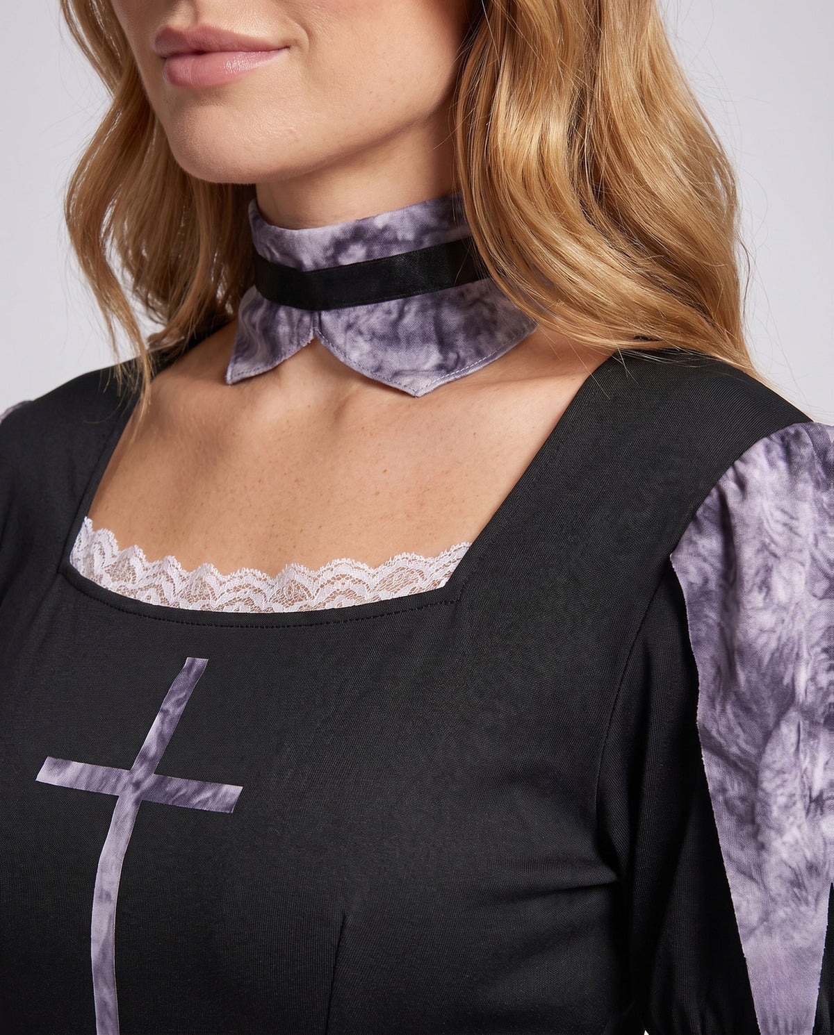 Women's scary nun Halloween costume with black long sleeve dress and jagged purple-gray print skirt - view 3
