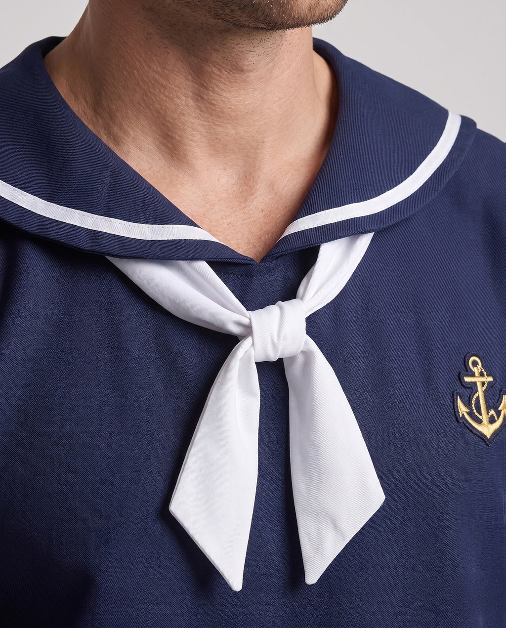 Men's navy sailor Halloween costume with white striped collar, white neckerchief and anchor patch - view 2