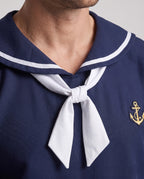 Men's navy sailor Halloween costume with white striped collar, white neckerchief and anchor patch - view 2