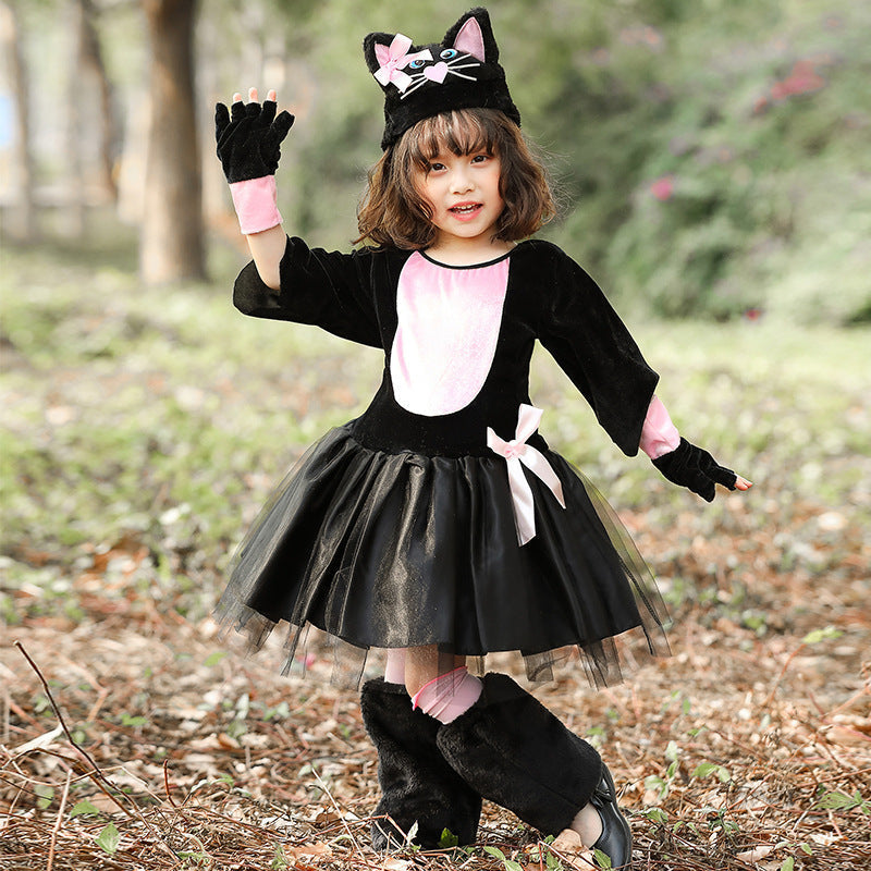 Girl wearing a black and pink cat costume with tulle skirt and cat-ear hat