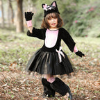 Girl wearing a black and pink cat costume with tulle skirt and cat-ear hat