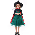 Girls Halloween costume with green tulle skirt, dark long-sleeve bodice and red tie cape