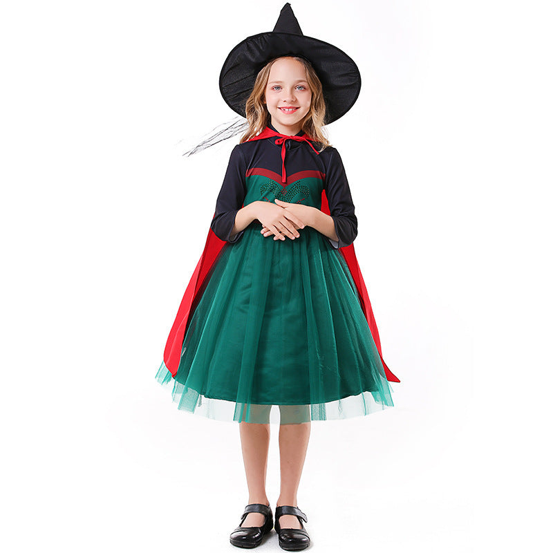 Girls Halloween costume with green tulle skirt, dark long-sleeve bodice and red tie cape