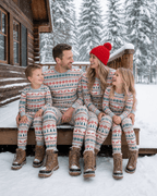 Family wearing matching Fair Isle Christmas pajamas with reindeer print and gray ribbed cuffs - view 3