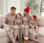 Family wearing matching Fair Isle Christmas pajamas with reindeer print and gray ribbed cuffs - view 5