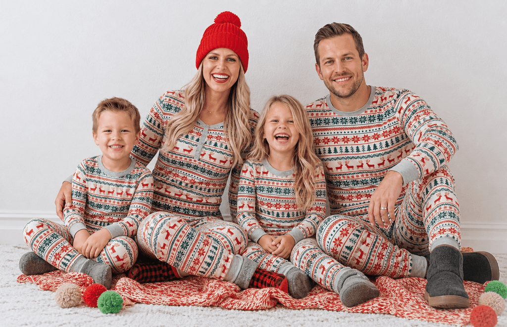 Family wearing matching Fair Isle Christmas pajamas with reindeer print and gray ribbed cuffs - view 6