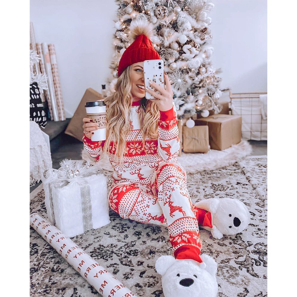 Matching family Christmas pajamas with red reindeer and snowflake print