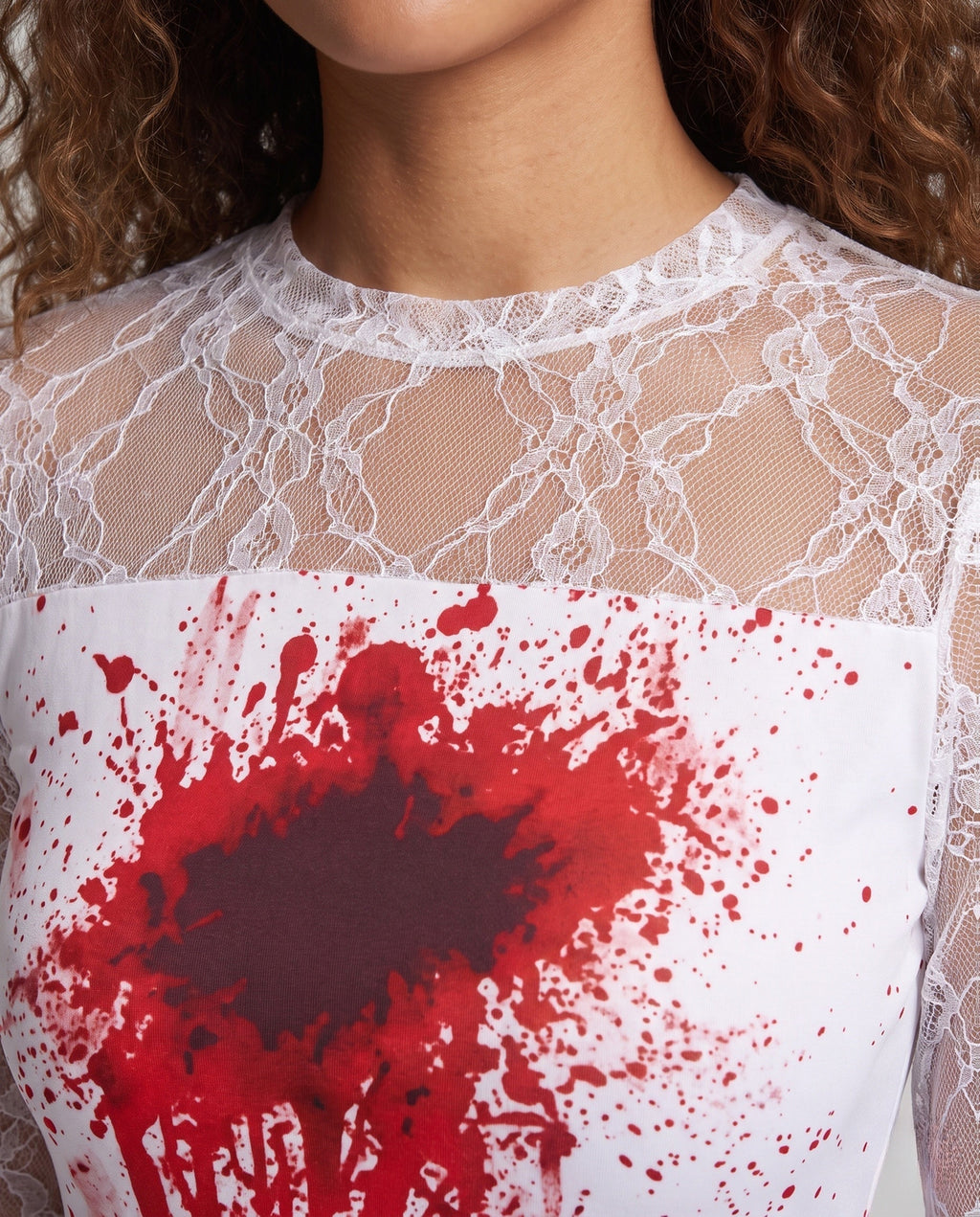 Woman wearing a bloody bride Halloween costume dress with lace sleeves, jagged hem and sheer lace veil - view 2