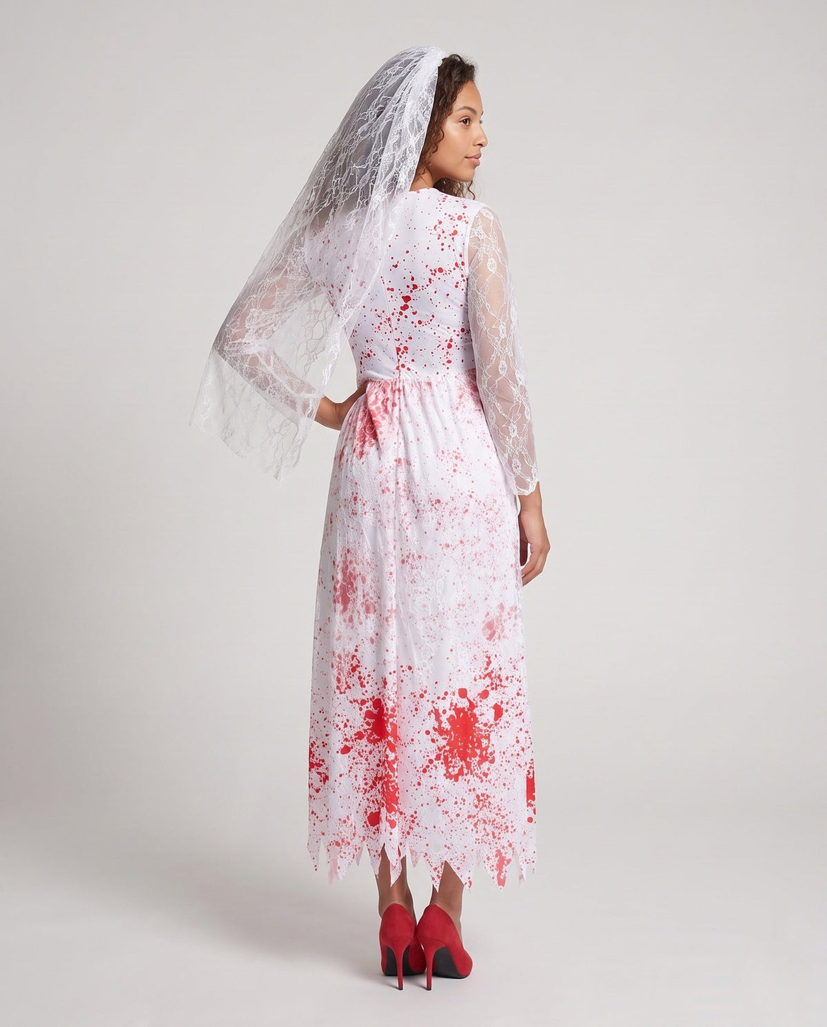 Woman wearing a bloody bride Halloween costume dress with lace sleeves, jagged hem and sheer lace veil - view 3