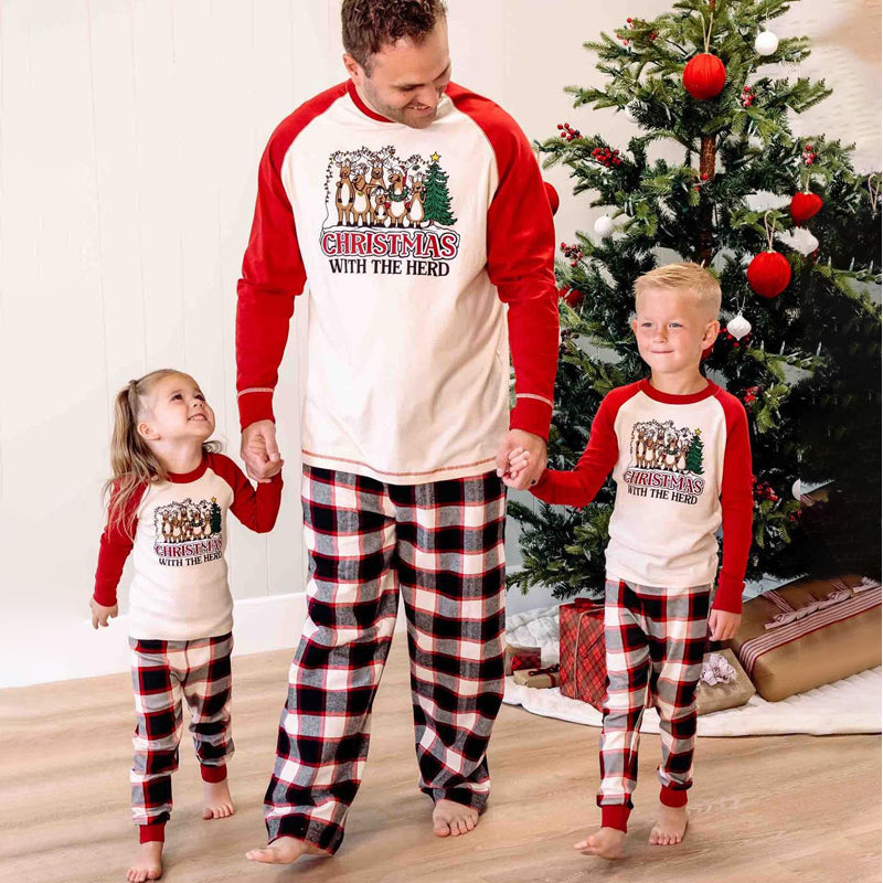 Matching Christmas pajamas with cream and red reindeer tee and plaid pants - view 6