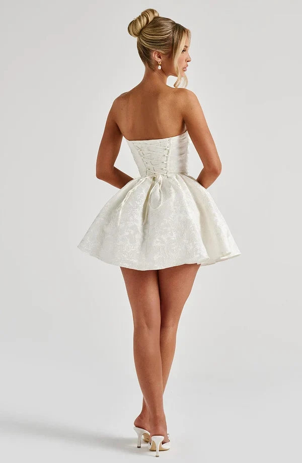 Strapless pink floral jacquard homecoming mini dress with oversized back bow and lace-up corset back - view 12