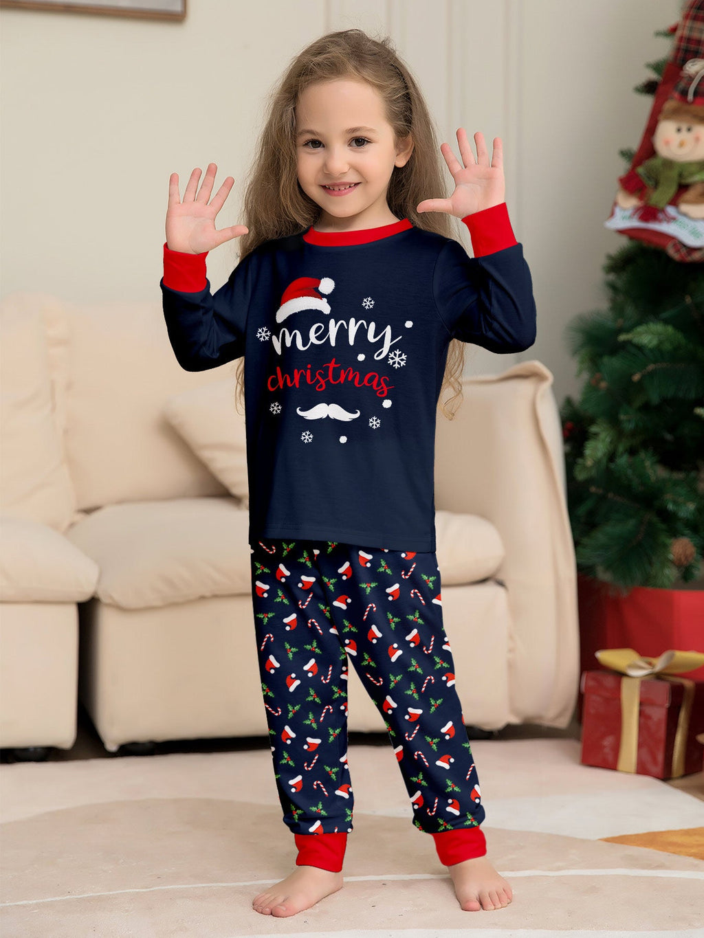 Matching family Christmas pajamas in navy with a Merry Christmas Santa hat top and holiday print pants - view 11