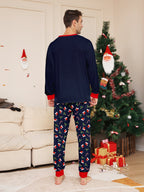 Matching family Christmas pajamas in navy with a Merry Christmas Santa hat top and holiday print pants - view 7