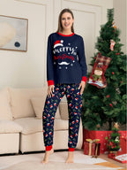 Matching family Christmas pajamas in navy with a Merry Christmas Santa hat top and holiday print pants - view 9