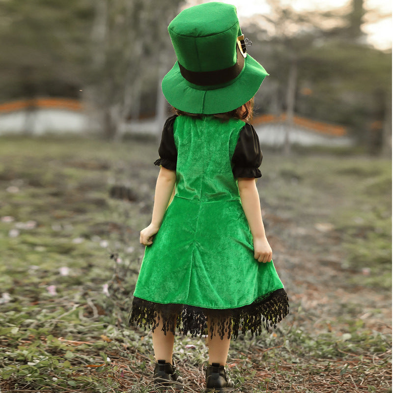 Girl wearing a green velvet leprechaun costume dress with lace-up front, black puff sleeves, fringed hem and tall buckled hat - view 3