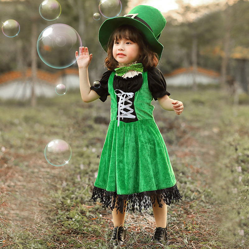 Girl wearing a green velvet leprechaun costume dress with lace-up front, black puff sleeves, fringed hem and tall buckled hat - view 4