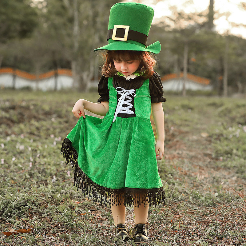 Girl wearing a green velvet leprechaun costume dress with lace-up front, black puff sleeves, fringed hem and tall buckled hat - view 6