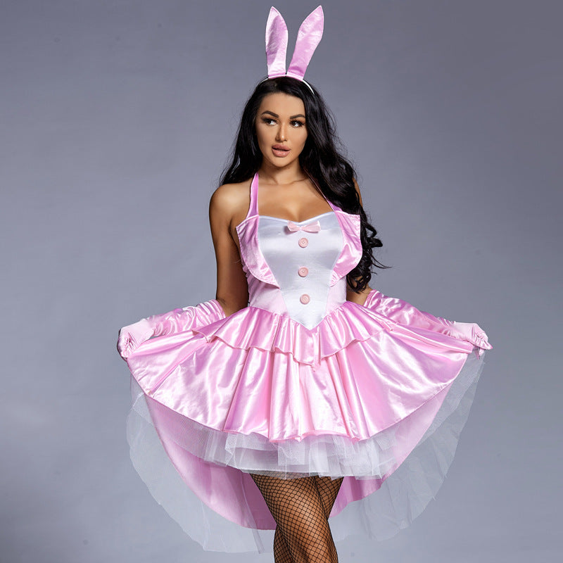 Woman wearing pink satin bunny costume with halter neck, white bib, ruffled tulle high-low skirt and bunny ears headband - view 2