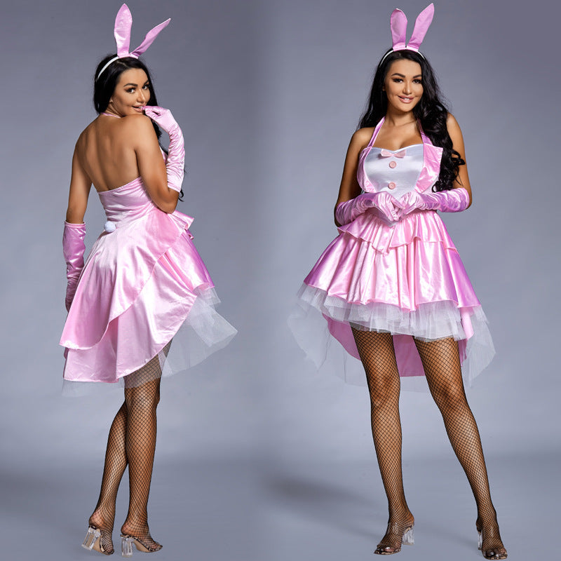 Woman wearing pink satin bunny costume with halter neck, white bib, ruffled tulle high-low skirt and bunny ears headband - view 4