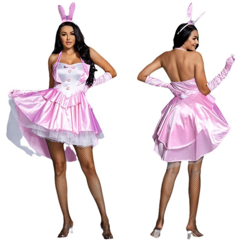 Woman wearing pink satin bunny costume with halter neck, white bib, ruffled tulle high-low skirt and bunny ears headband - view 5