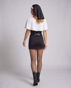 Women's nun Halloween costume with black keyhole mini dress, gold-trim white capelet, headpiece and O-ring belt - view 3