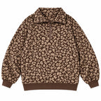 Woman wearing an oversized quarter zip sweatshirt in dark brown leopard print ribbed knit with black leggings - view 11