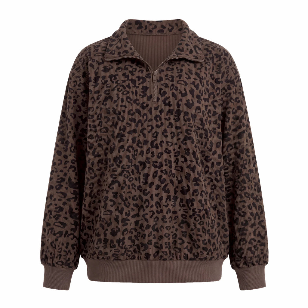 Woman wearing an oversized quarter zip sweatshirt in dark brown leopard print ribbed knit with black leggings - view 4