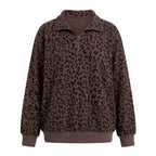 Woman wearing an oversized quarter zip sweatshirt in dark brown leopard print ribbed knit with black leggings - view 4