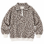Woman wearing an oversized quarter zip sweatshirt in dark brown leopard print ribbed knit with black leggings - view 9